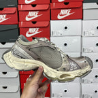 Balenciaga unisex running shoes, front side view with gray mesh upper and off-white midsole