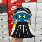 Unisex running shoe heel view, white sole with Balenciaga branding on black tread.