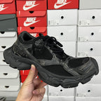 Black mesh athletic sneaker with black laces and cushioned midsole, side view