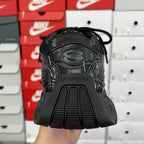 Black athletic sneaker heel with BALENCIAGA branding and ribbed sole edge, back view
