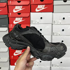 Black mesh athletic sneaker with black laces and cushioned sole, side angle