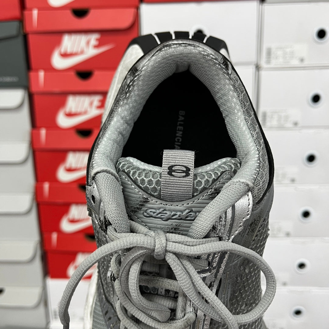 Unisex Balenciaga running shoe, open collar view with dark interior lining
