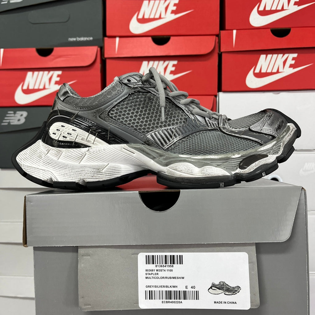 Unisex Balenciaga running shoes on box, dark gray mesh with layered silver accents