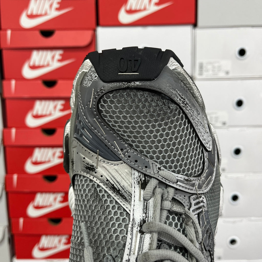 Unisex Balenciaga running shoe, black heel counter and dark gray mesh side panel