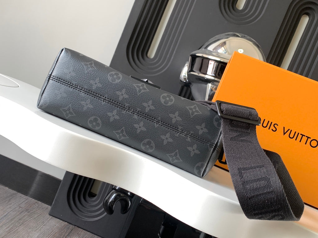 Louis Vuitton shoulder bag with long strap and flap, dark monogram canvas, zip detail.
