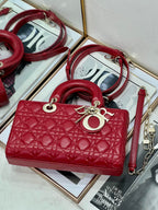 Dior red quilted mini handbag with top handle and detachable shoulder strap