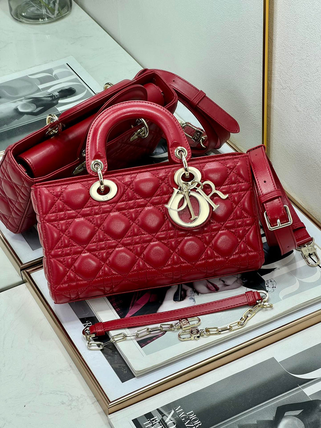 Dior red quilted handbag with top handles and adjustable shoulder strap