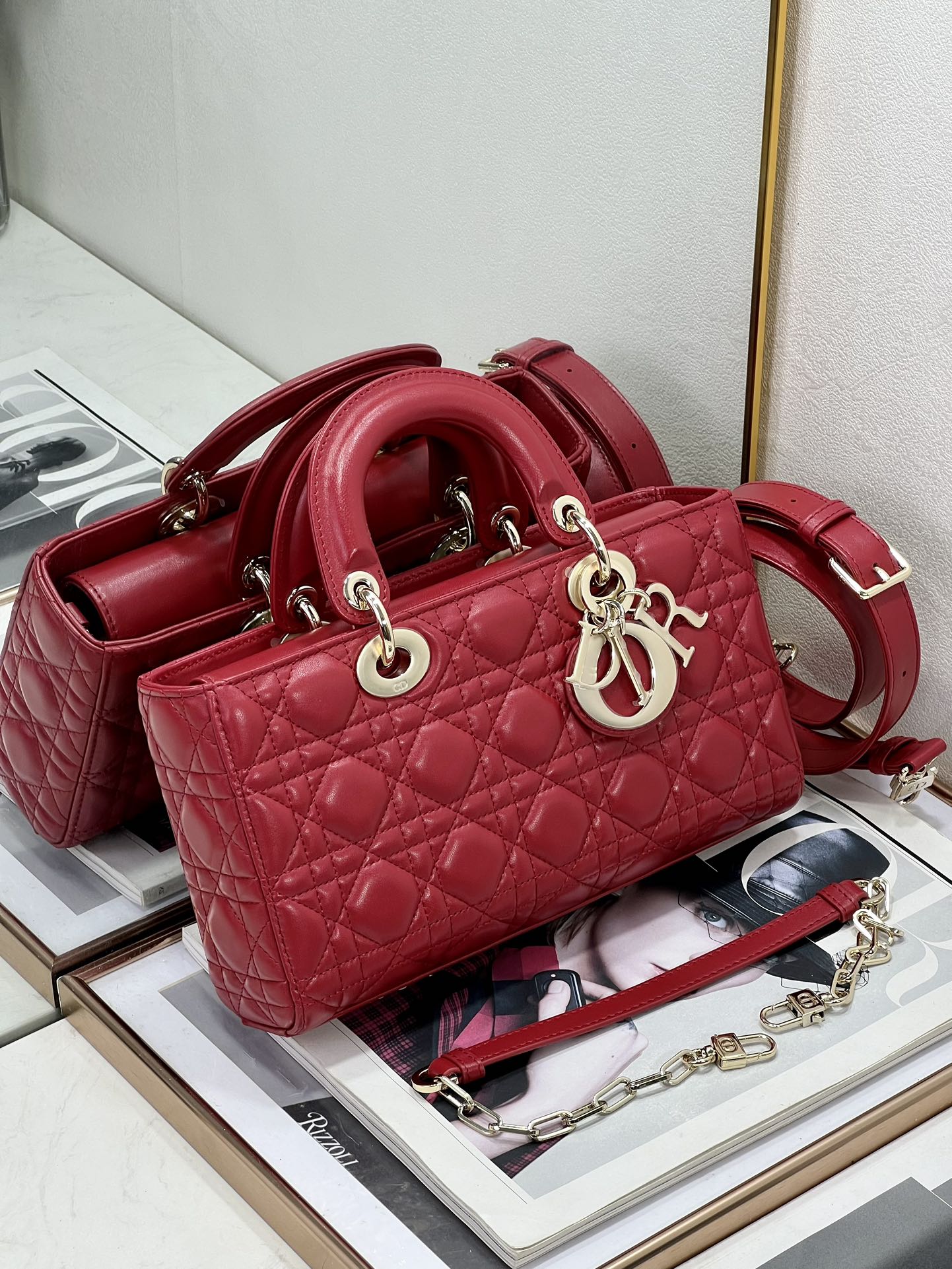 Dior red quilted handbag with curved top handles and crossbody strap