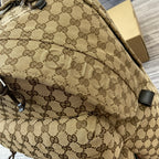 Gucci men's backpack side panel with GG monogram pattern and stitched trim
