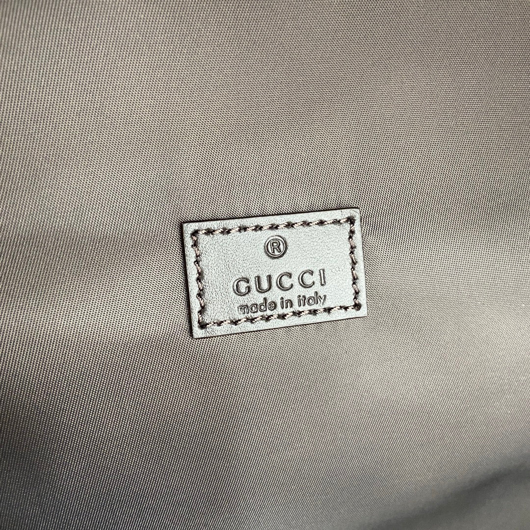 Gucci men's backpack interior label reading Gucci and made in Italy