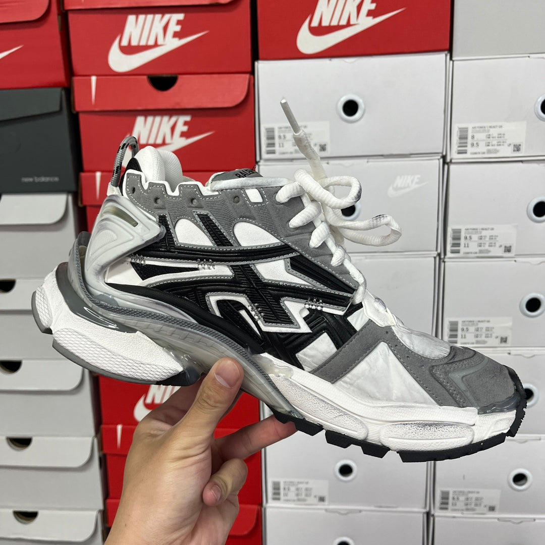 Balenciaga chunky sneakers side view with gray panels, black accents, and white laces