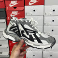 Balenciaga chunky lace-up sneakers in gray, white, and black with thick sole