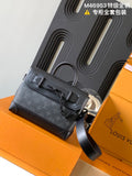 Louis Vuitton monogram handbag with top handle and shoulder strap, dark gray.