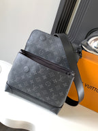 Louis Vuitton monogram mini handbag with adjustable strap, dark gray.