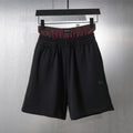 Black elastic-waist shorts with red plaid waistband trim