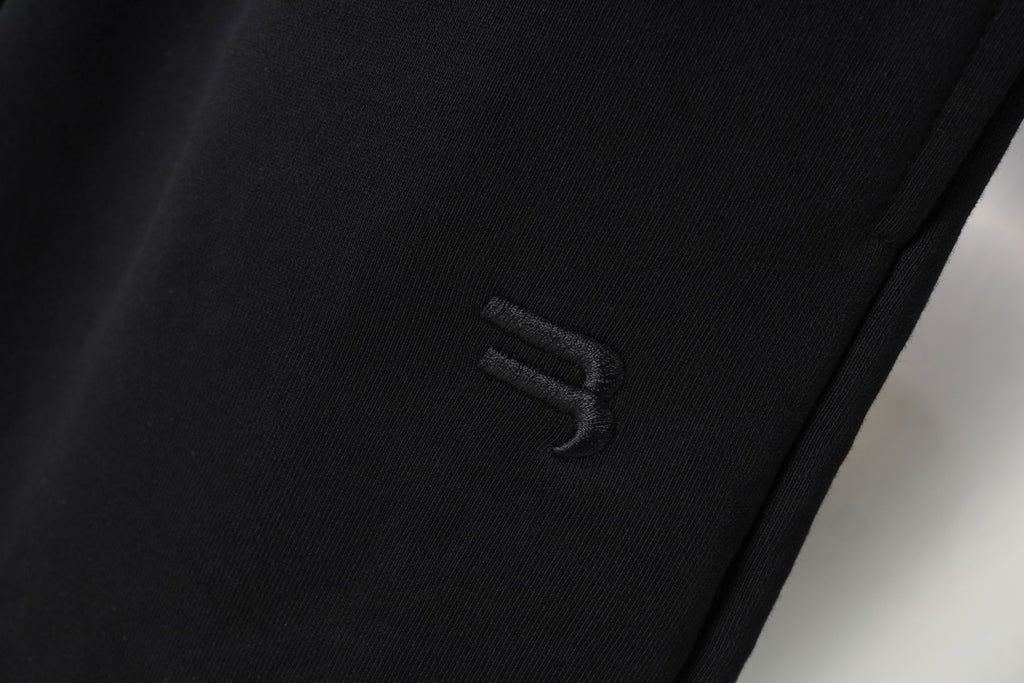 Black shorts with small embroidered logo on side seam
