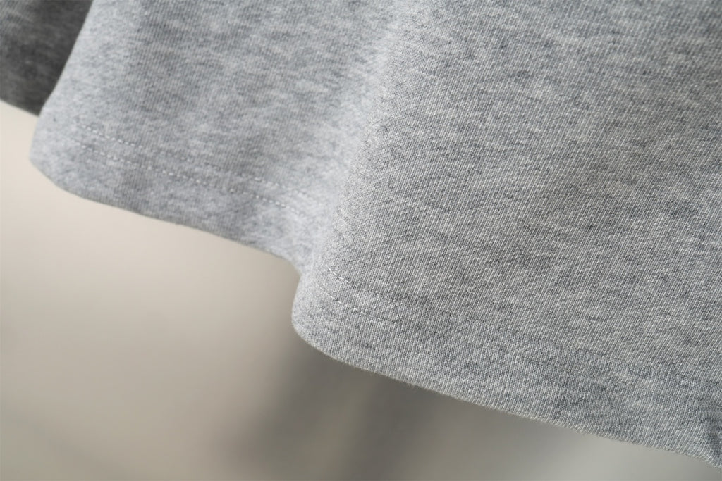 Balenciaga gray shorts with curved hem and textured knit fabric