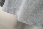 Balenciaga gray shorts with curved hem and textured knit fabric