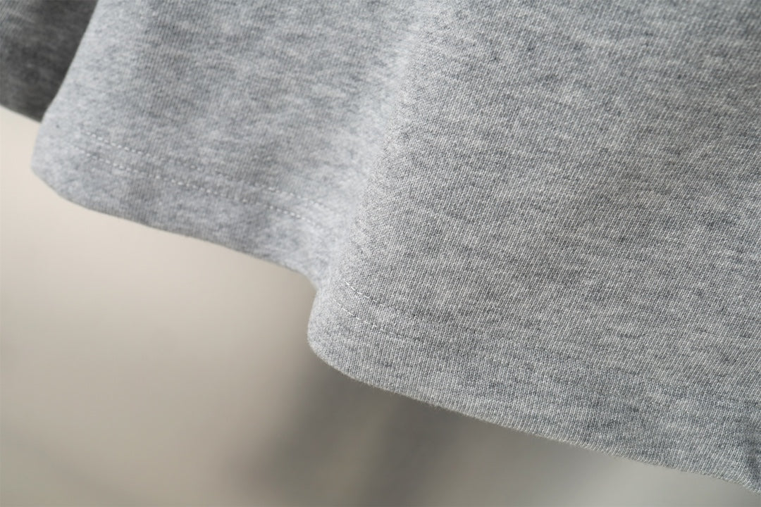 Balenciaga gray shorts with curved hem and textured knit fabric