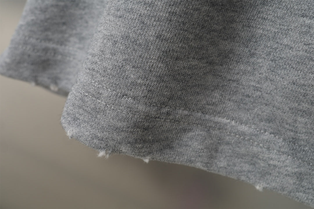 Gray shorts with raw, slightly frayed hem edge