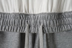 Elastic waistband with gathered ruching on grey sweat shorts