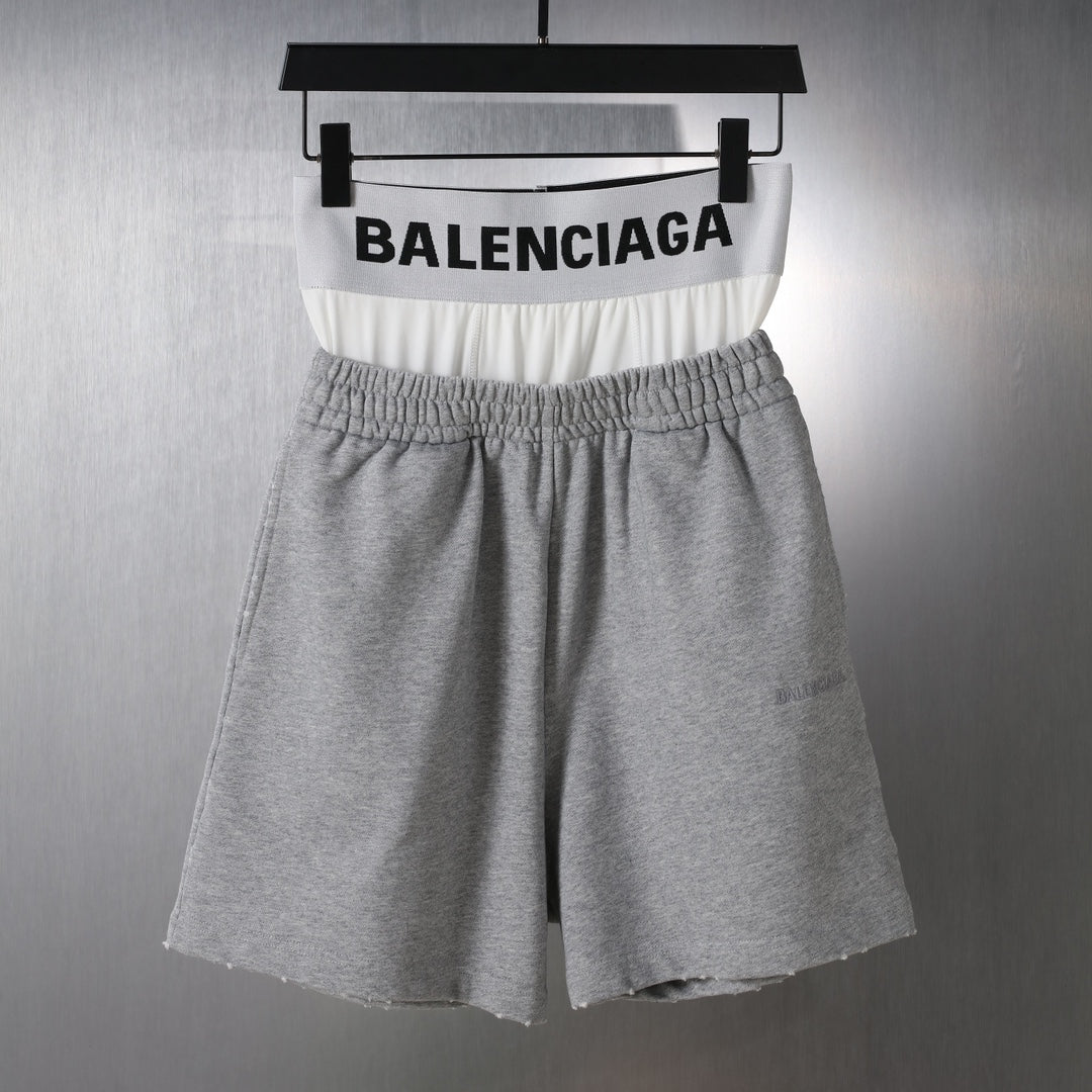 Grey sweat shorts with elastic waistband and Balenciaga logo band at the waist