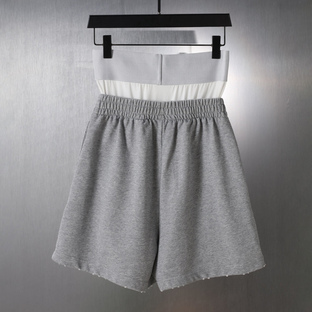 Gray shorts with white waistband panel and elastic waist