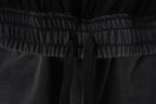 Elastic waistband detail on black Balenciaga shorts, close-up