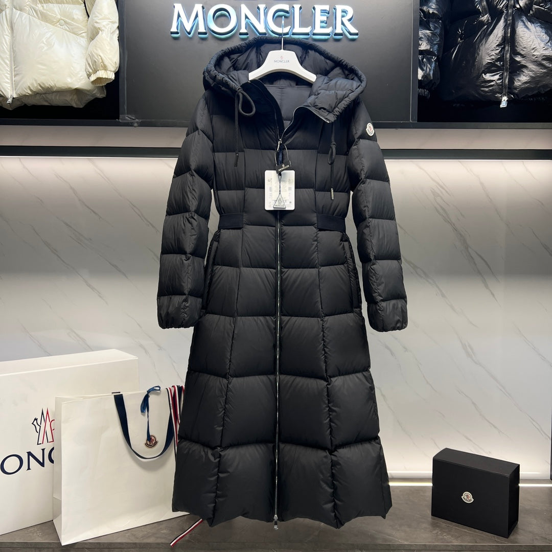 Long puffer coat with hood, front zipper, and quilted diamond stitching