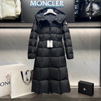 Long puffer coat with attached hood, front zipper, and quilted diamond panels
