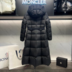Long puffer coat back view with hood, quilted panels, and center zipper