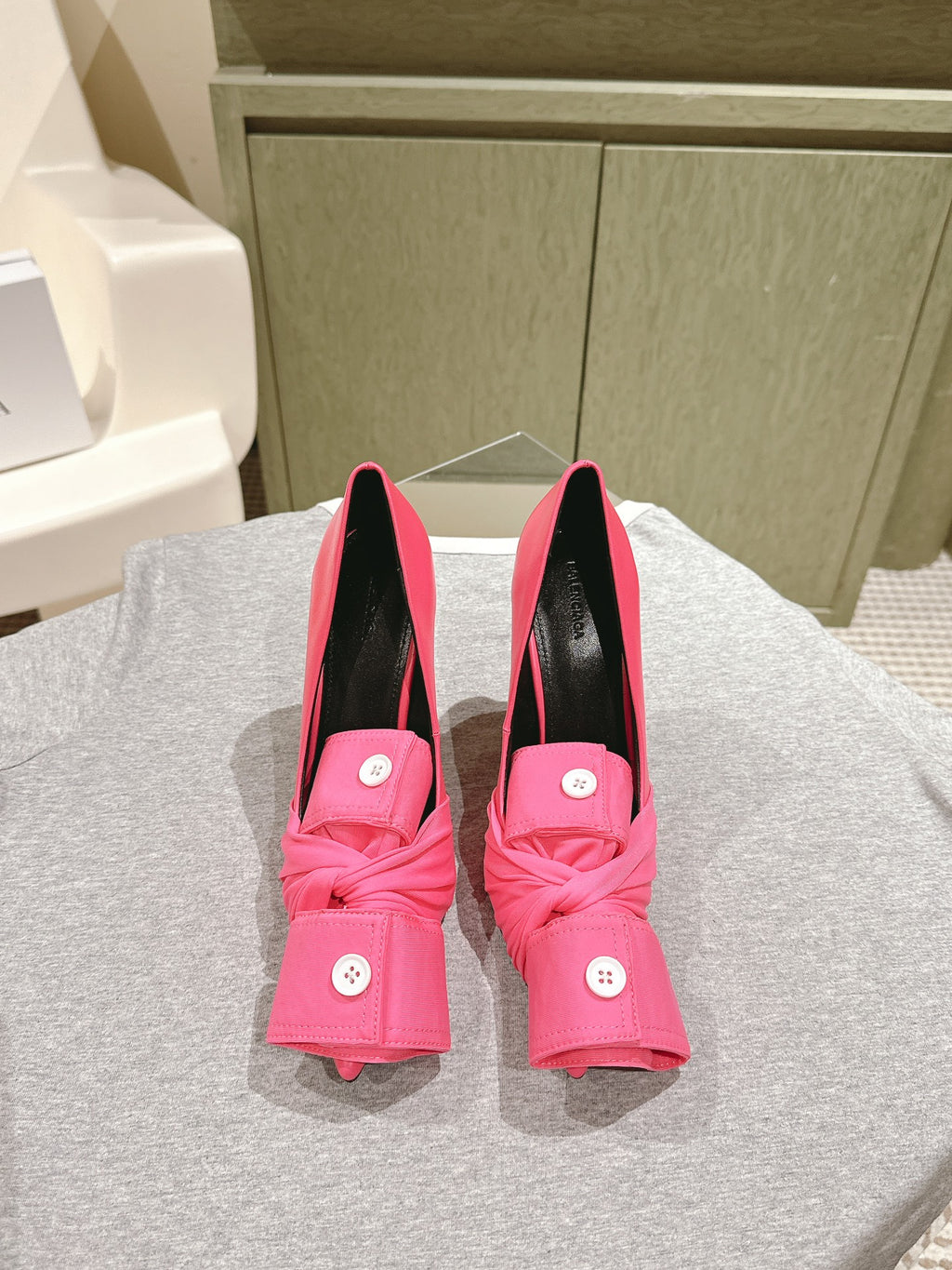 Pink Balenciaga sandals with black lining, knotted front detail and stiletto heel