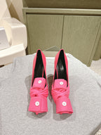 Pink Balenciaga sandals with black lining, knotted front detail and stiletto heel
