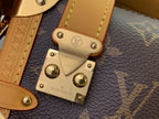 Louis Vuitton bag hardware close-up with gold plates and snaps on dark monogram base