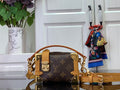 Louis Vuitton bag in dark brown monogram canvas with tan leather handles and gold hardware