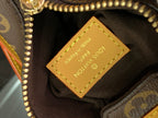Louis Vuitton bag interior label on dark lining with tan stitched frame