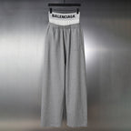 Grey Balenciaga sweatpants with elastic waistband and wide relaxed legs