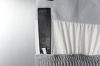 Grey sweatpants with inner waistband label and black care tag strip