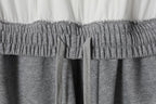 Grey sweatpants waistband with elastic smocking and inner drawstring ties