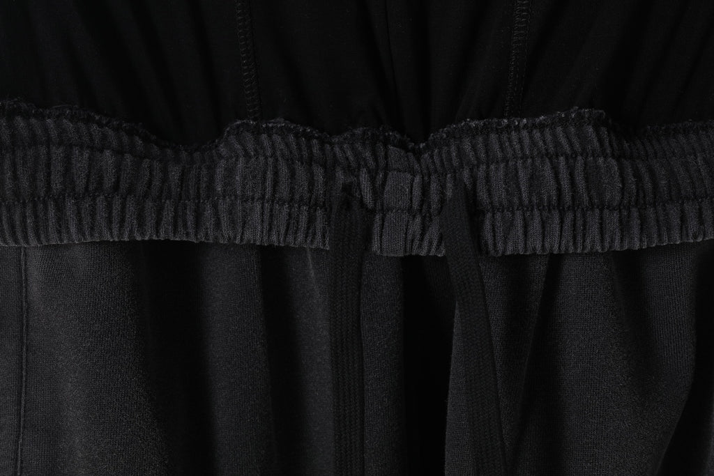 Black pants with elastic waist seam and gathered waistband