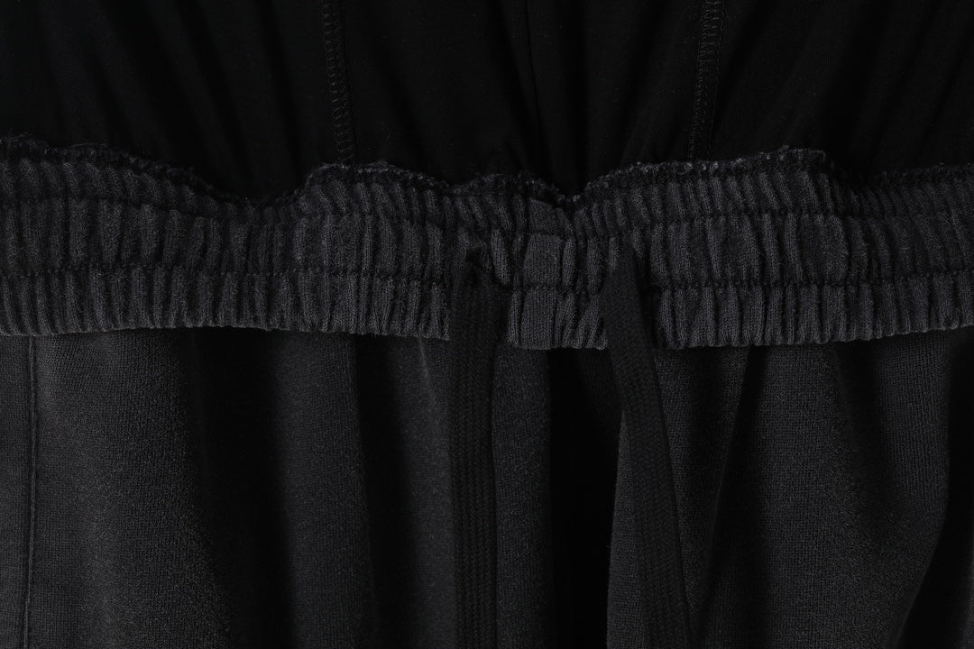 Elastic waistband and gathered center seam on black Balenciaga pants
