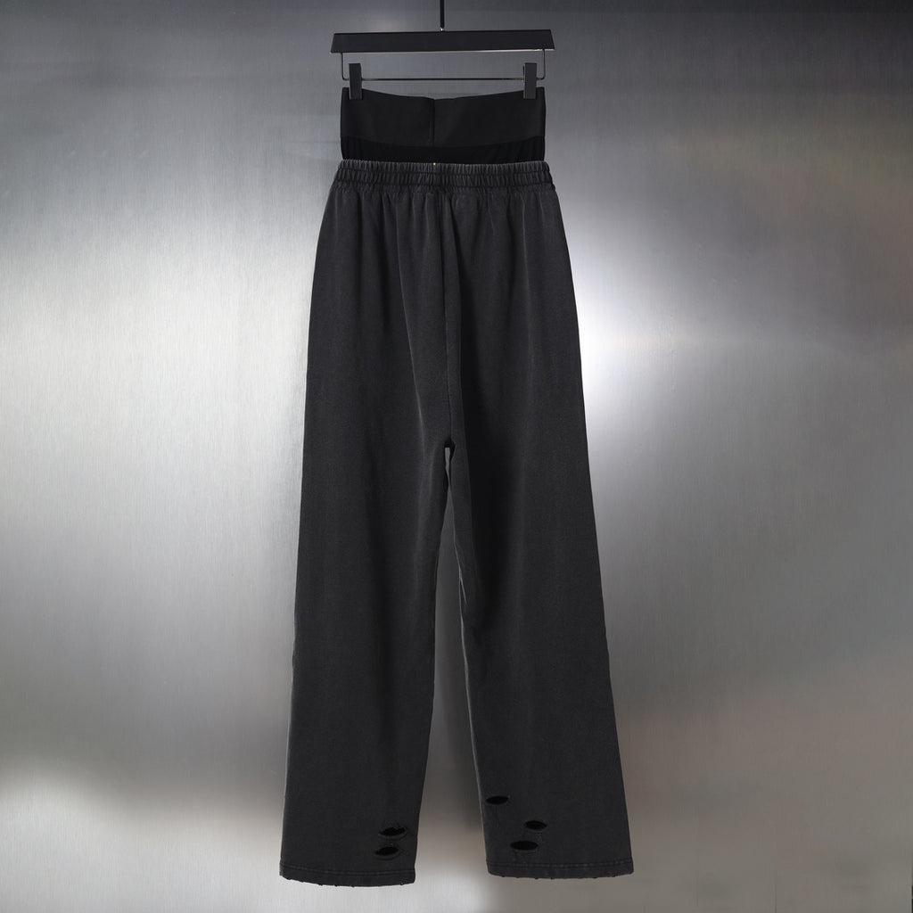 Black pants with elastic waistband, wide legs, and logo waistband band