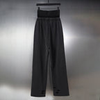 Black pants with elastic waistband, wide legs, and logo waistband band