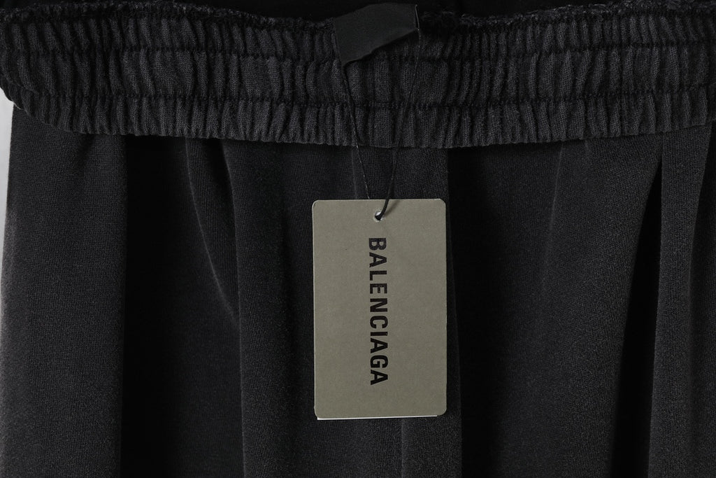 Black sweatpants with BALENCIAGA hang tag on elastic waistband