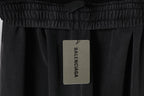 Black sweatpants with BALENCIAGA hang tag on elastic waistband