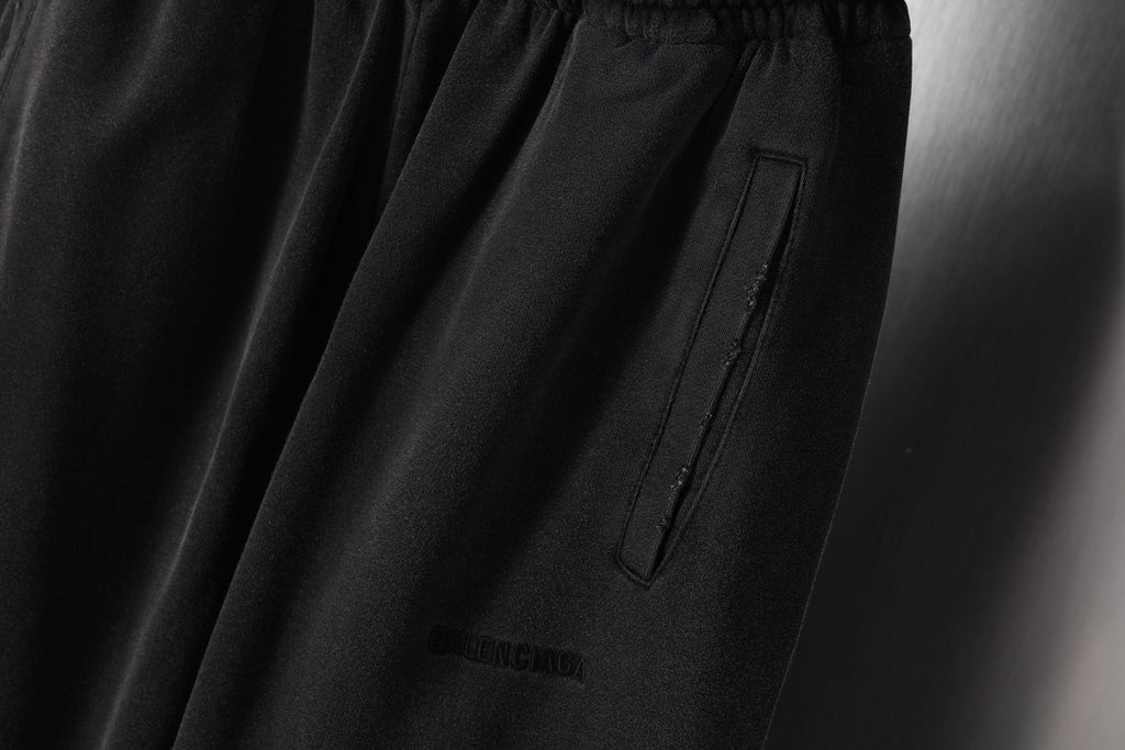 Black pants with vertical pocket and small logo print