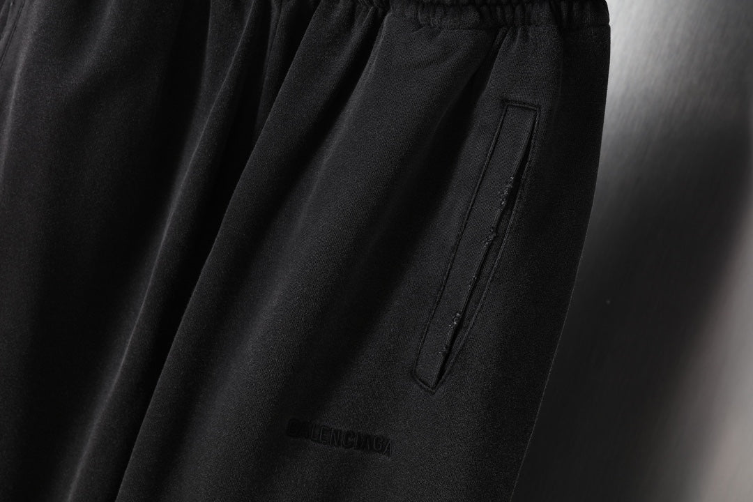 Black sweatpants with front patch pocket and small BALENCIAGA logo