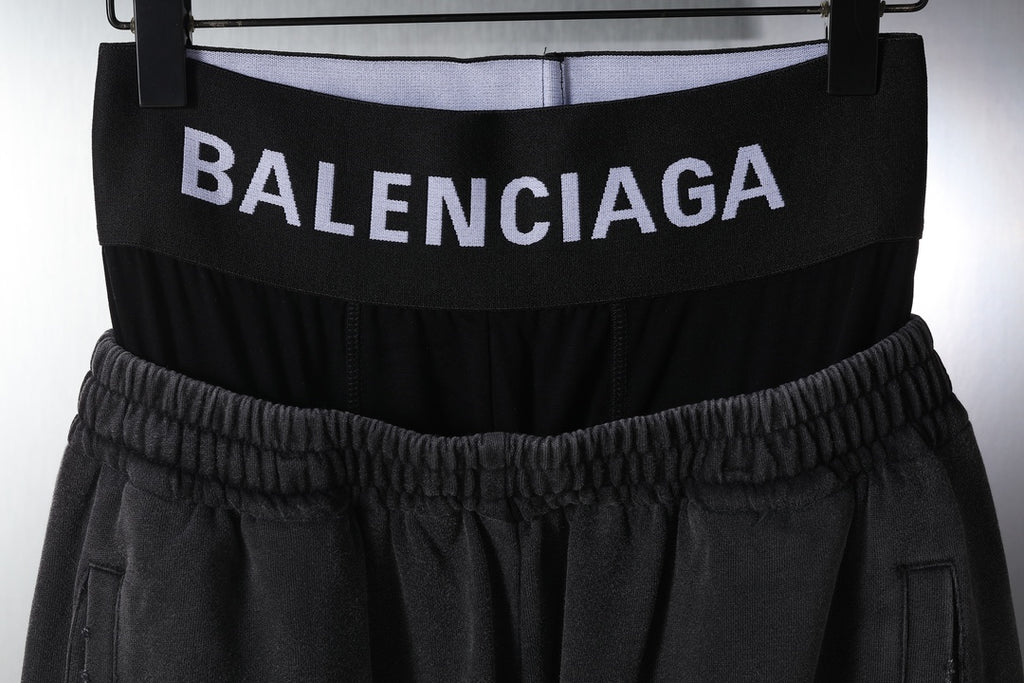 Black pants with elastic waistband and BALENCIAGA logo on waistband
