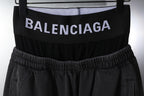 Black pants with elastic waistband and BALENCIAGA logo on waistband