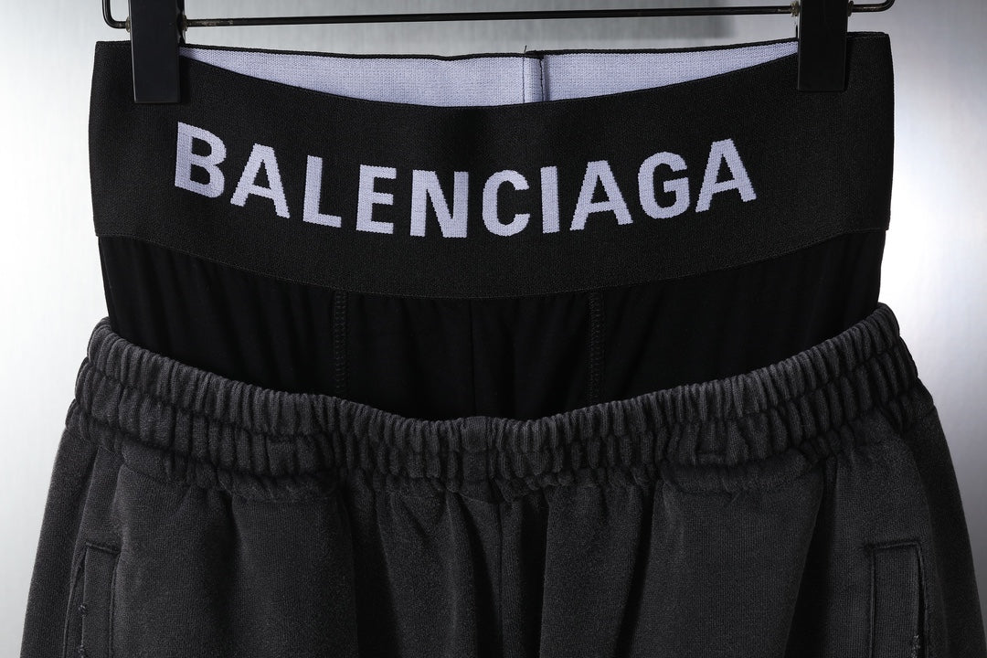 Balenciaga waistband with printed logo and gathered elastic at the top of black pants